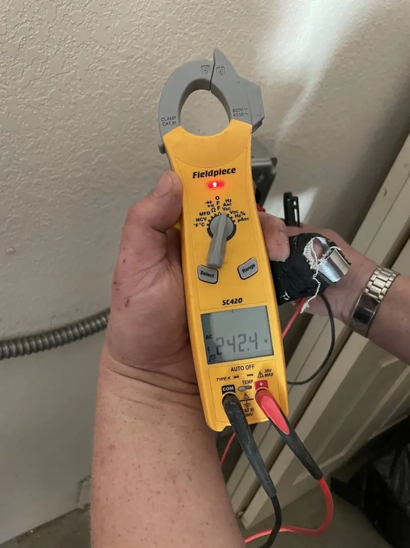 Voltage testing with clamp meter during Circuit Breaker Repair in Berryville